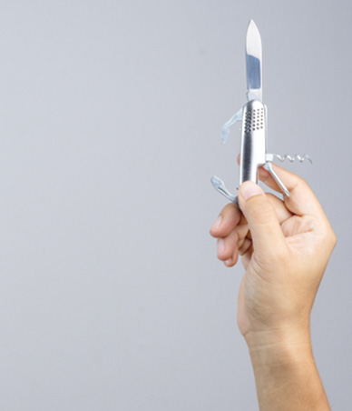 Hand holding Swiss army knife