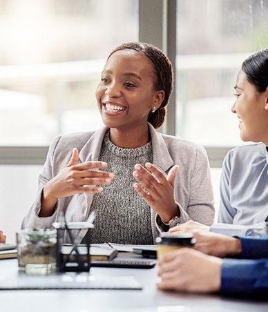 Team of professionals talking during meeting