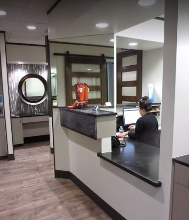 Orthodontic receptionist sitting at front desk