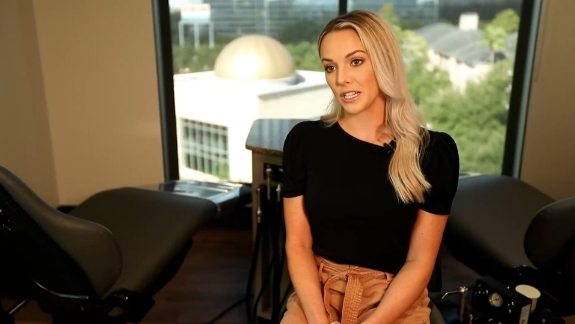 Blonde woman sitting in orthodontic office in Houston