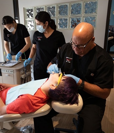 Doctor Hall treating a young orthodontic patient