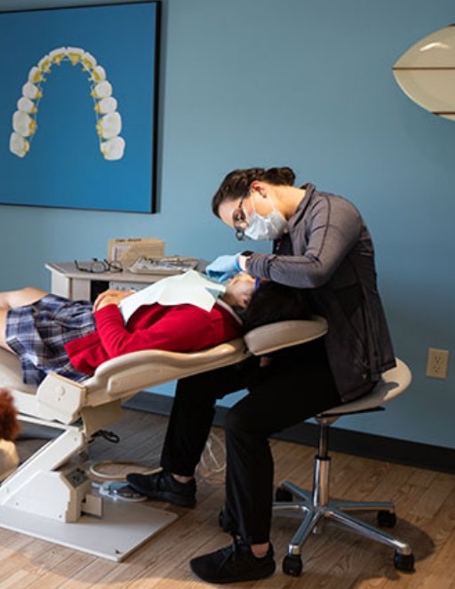 Orthodontic team member treating a patient in Greater Heights Houston orthodontic office