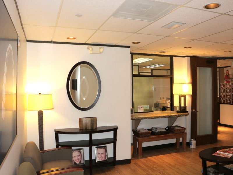 Wall mirror and lamp in reception area