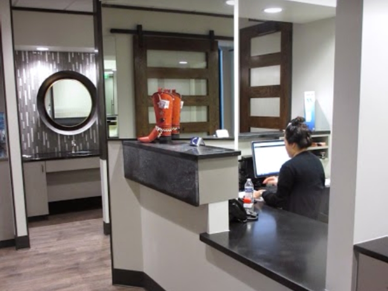 Orthodontic team member at front desk on computer