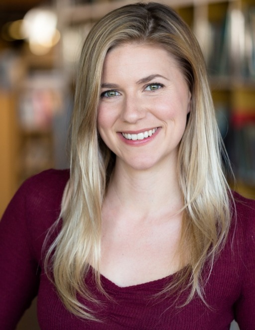 Blonde woman in red blouse smiling